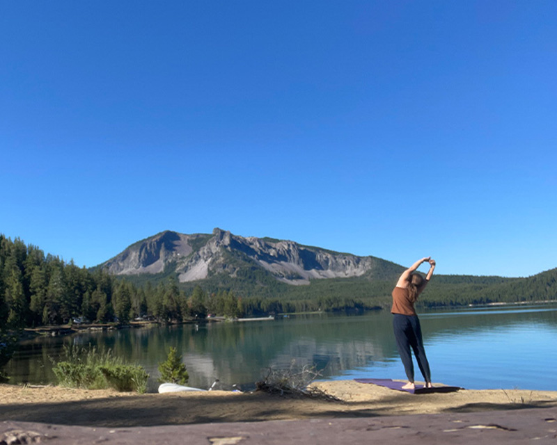 Blogger Tawna found the perfect location off the shore of Paulina Lake for her daily yoga routine in July 2022.