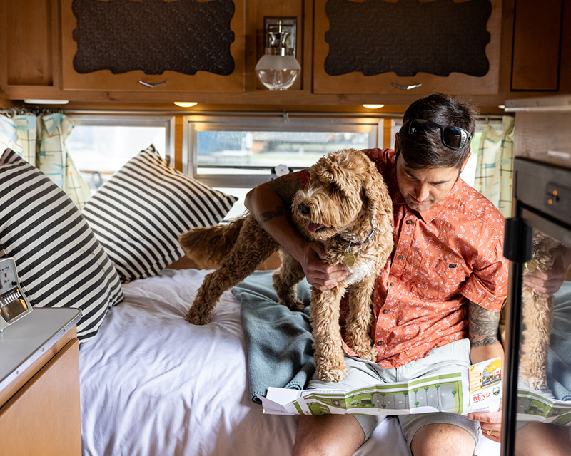 Man and dog in rented RV in Bend, OR