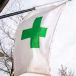 Green cross cannabis flag in Bend, OR