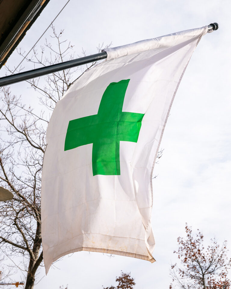 Green cross cannabis flag in Bend, OR