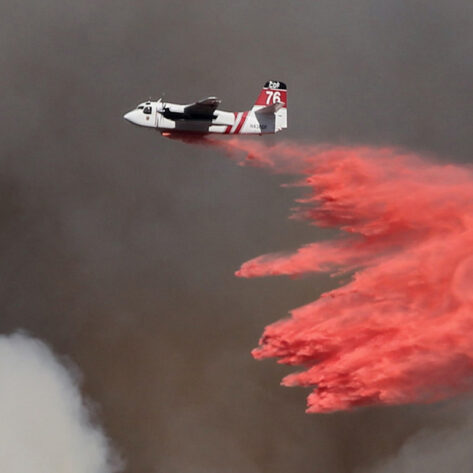 Airplane dropping fire retardant in Bend, OR