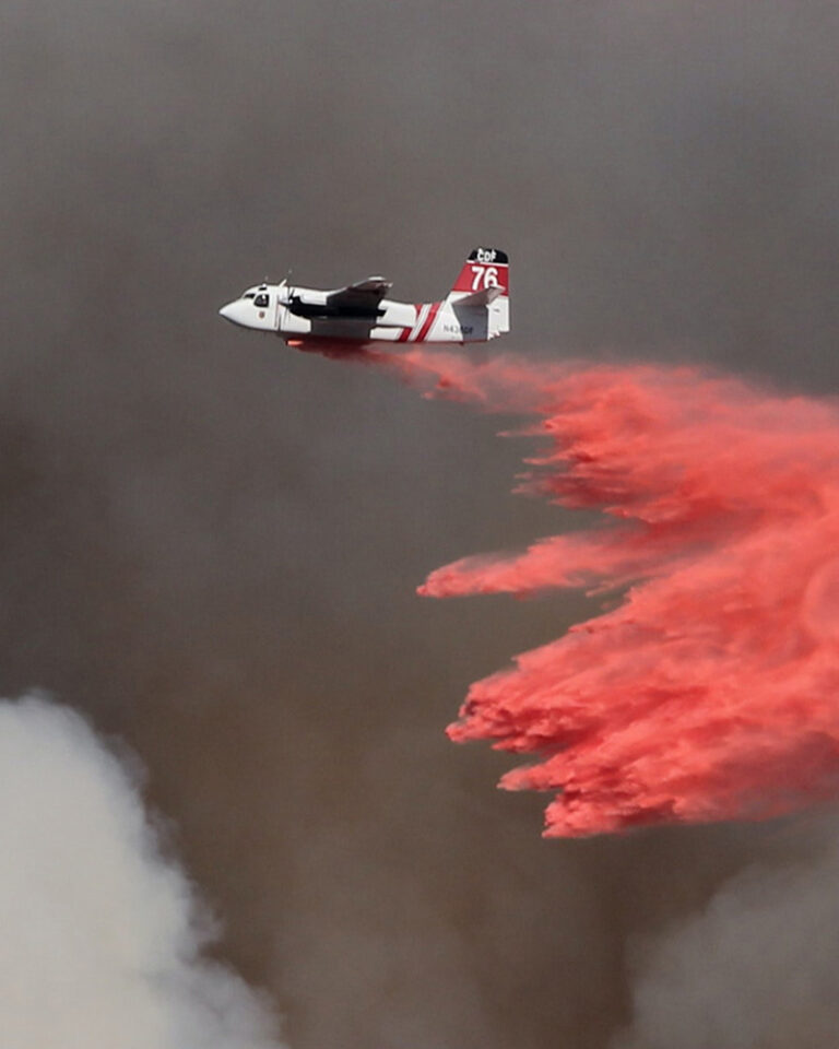 Airplane dropping fire retardant in Bend, OR