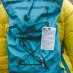 Leave No Trace tag hangs on the backpack of a hiker in Bend, Oregon.