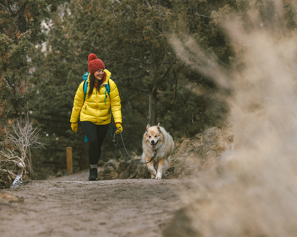 Woman and dog hike in Bend, Oregon. 