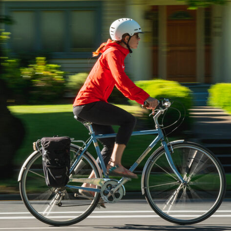 Pro Cyclist Serena Gordon biking through Downtown Bend, Oregon.