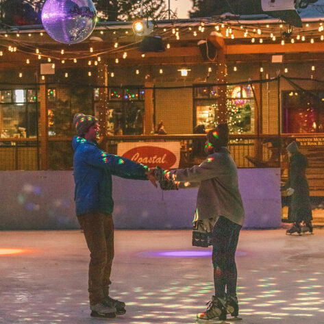 Couple ice skating at the Inn at 7th Mountain Resort in Bend, Oregon.