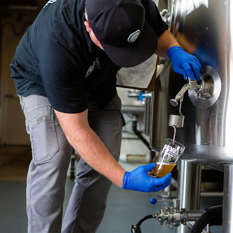 Beer being poured at Bevel Brewing in Bend, Oregon. 