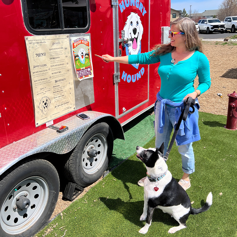 Blogger Tawna and her dog Jack Jack check out the dog-specific menu at Hungry Hounds food cart in Bend, Oregon. 