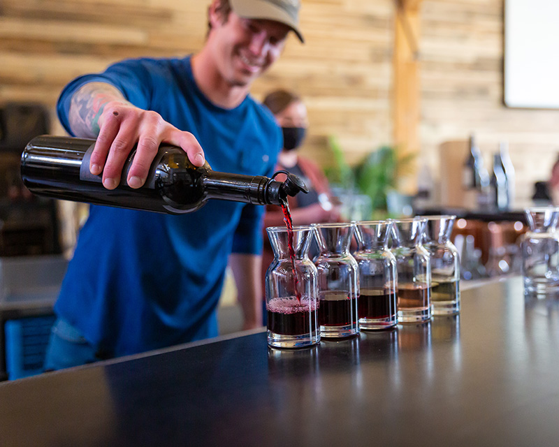 A flight of wine being poured at Stoller Wine Bar in Bend, OR