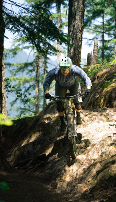 Mountain biker navigating a steep rocky descent on King’s Castle Trail, one of the best mountain bike trails offering challenging terrain near Bend, Oregon.