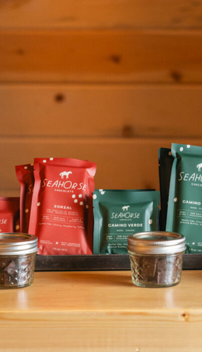 Packaged artisan chocolate bars from Dr. Chocolate displayed at a workshop in Bend, Oregon, featuring sustainably sourced ingredients and some of Bend’s best desserts.