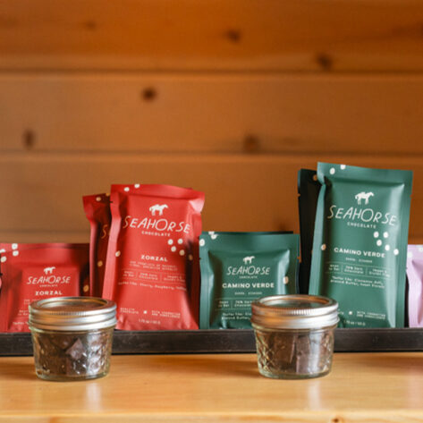 Packaged artisan chocolate bars from Dr. Chocolate displayed at a workshop in Bend, Oregon, featuring sustainably sourced ingredients and some of Bend’s best desserts.