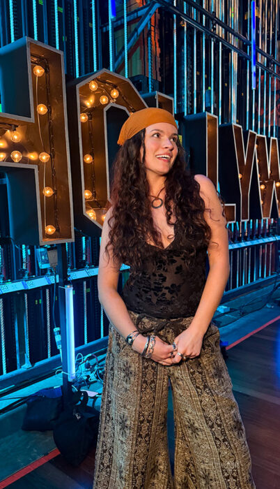 ella Emry, American Idol Top 30 finalist from Bend Oregon, backstage at American Idol wearing an orange bandana